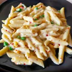 A picture of Penne Pasta in Bechamel Sauce.