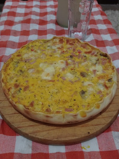 Una foto de Tarta de jamón, muzzarella y champiñones