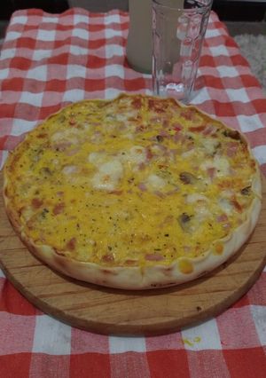 Una foto de Tarta de jamón, muzzarella y champiñones