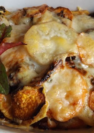 Foto principal de Gratinado de batatas y patatas con provolone