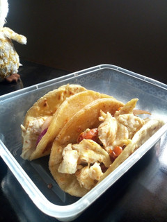 A picture of Potato bread and scrambled eggs tacos.