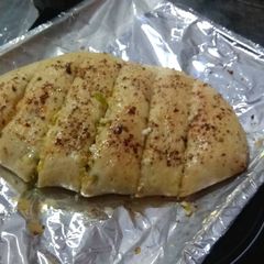 A picture of Paneer Stuffed garlic bread.