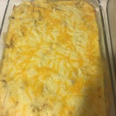 A picture of White sauce enchiladas.