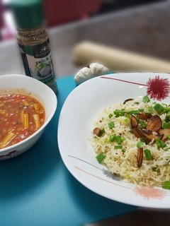 A picture of Burnt chilli garlic rice with baked beans gravy.