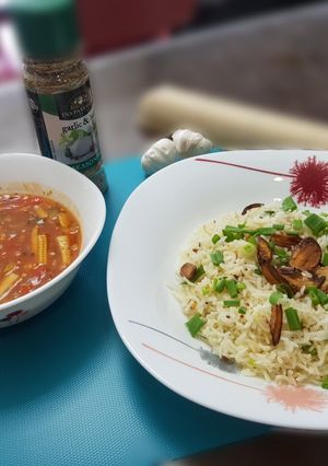 A picture of Burnt chilli garlic rice with baked beans gravy.