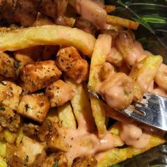 A picture of Chicken loaded fries 🍟.