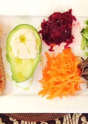 A picture of Sesame seared salmon, Tahini avocado and shred salad.