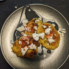 A picture of Courgette pancakes with feta & honey.