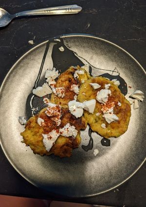 A picture of Courgette pancakes with feta & honey.