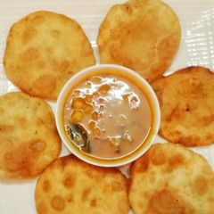 A picture of Daal kachori with aloo tarkari.