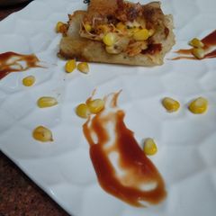 A picture of Spicy corn cheese dosa.