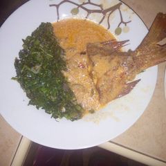 A picture of Marinated fish (samaki wa kupaka) with coconut soup..