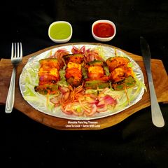 A picture of Paneer Tikka Veg Sizzler - Party Starter Bites.