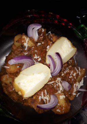 A picture of Cheese stuffing dum aloo(potato).