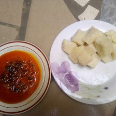 A picture of Boiled yam and red oil.