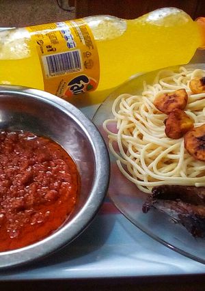 A picture of Signature fish sauce spaghetti and fried plantain.