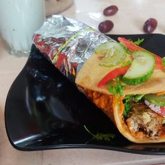 A picture of Jain Paneer Tikka Masala Shawarma.