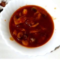 A picture of Red chilli mushroom gravy.