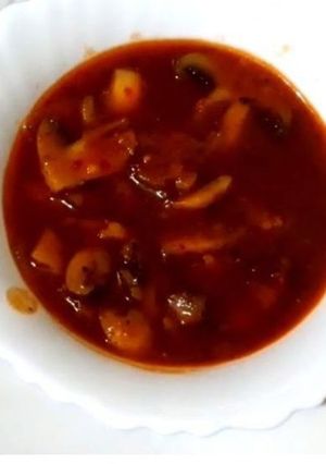 A picture of Red chilli mushroom gravy.