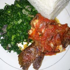 A picture of Wet fry fish served with Ugali and Kales.