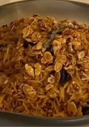 A picture of Rice with dry fruit.