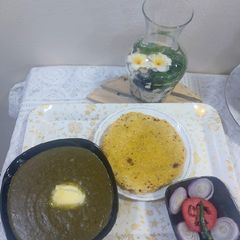 A picture of Sarson ka Saag with makai roti.
