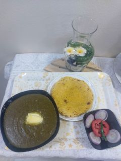 A picture of Sarson ka Saag with makai roti.