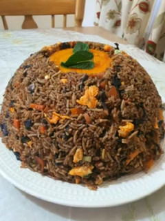 A picture of Volcano rice with pepper sauce.