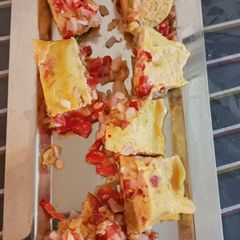 A picture of Steam omellete with chips.