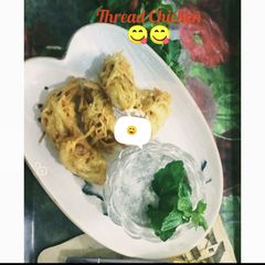 A picture of Thread Chicken with minty mayo sauce.