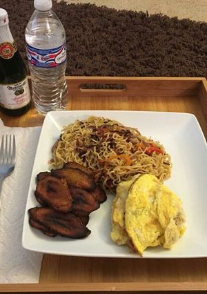 A picture of Pan fried Noodle, Eggs and Plantain.