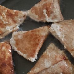A picture of Tortila, lentil samosa.