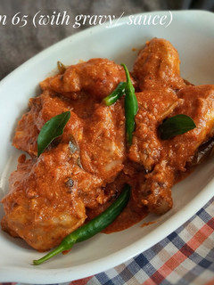 A picture of Chicken 65 with sauce/Gravy.