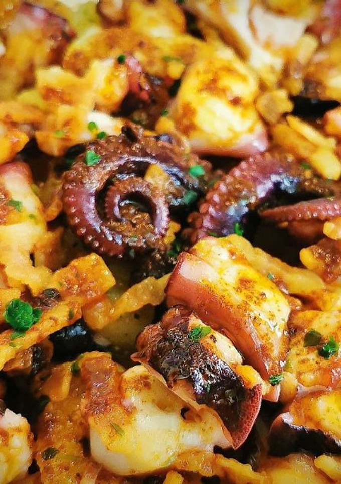Una foto de Pulpo a la Gallega  con Papada ibérica