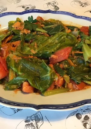 Une photo de Kai lan aux tomates,carotte,ail et sauce huître