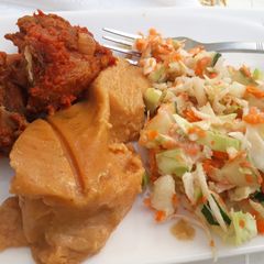 A picture of Moimoi,coleslaw and fried meat.