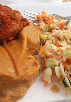 A picture of Moimoi,coleslaw and fried meat.