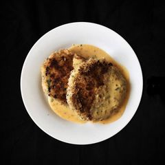A picture of Salmon fishcakes with spice dijon sauce.
