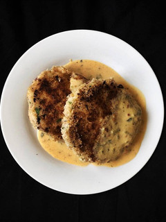 A picture of Salmon fishcakes with spice dijon sauce.