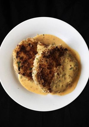 A picture of Salmon fishcakes with spice dijon sauce.