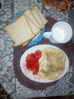 A picture of Black pepper eggs,sliced tomatoes.