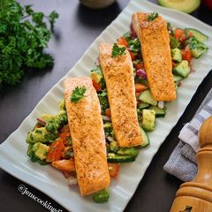 A picture of Pan Seared Salmon with Avocado Tomato Cucumber Salad.