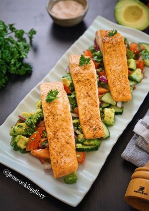 A picture of Pan Seared Salmon with Avocado Tomato Cucumber Salad.
