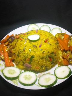 A picture of Dambu shinkafa with veg.sauce.