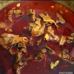A picture of Mutton qorma and homemade nan.