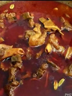 A picture of Mutton qorma and homemade nan.
