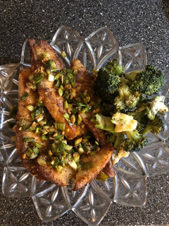 A picture of Fish 🐟 Tilapia and Ginger-Roasted Cheese 🧀 Broccoli 🥦.