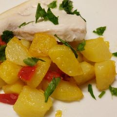 A picture of Pan fried swordfish with peppers and potatoes.