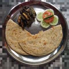 Roasted bhindi with lacha roti A picture of Roasted bhindi with lacha roti.