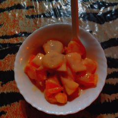 A picture of Fruit salad with custard.